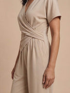 Damen-Jumpsuit in Wickeloptik mit umgeschlagenem Saum